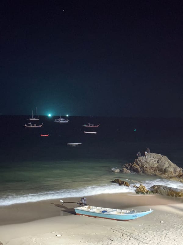 Sunset observed at Patong Beach with boats offshore