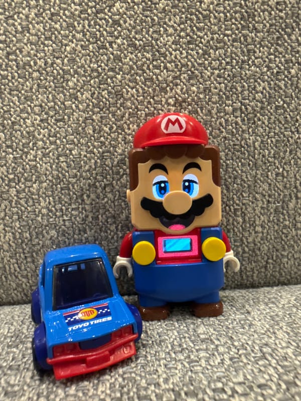 Toy collection close-ups: LEGO Mario, Minecraft Creeper, and Hot Wheels