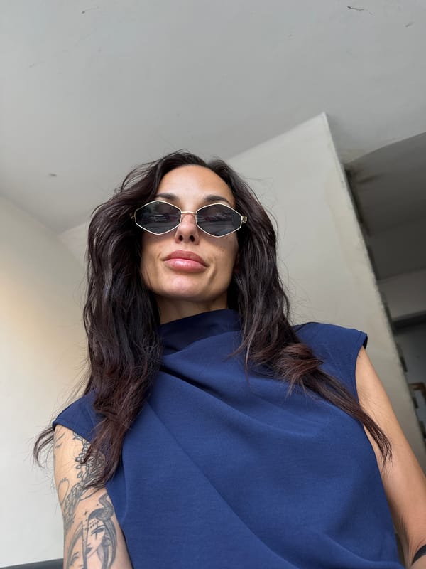 Woman in sunglasses spotted indoors in Pleven building hallway