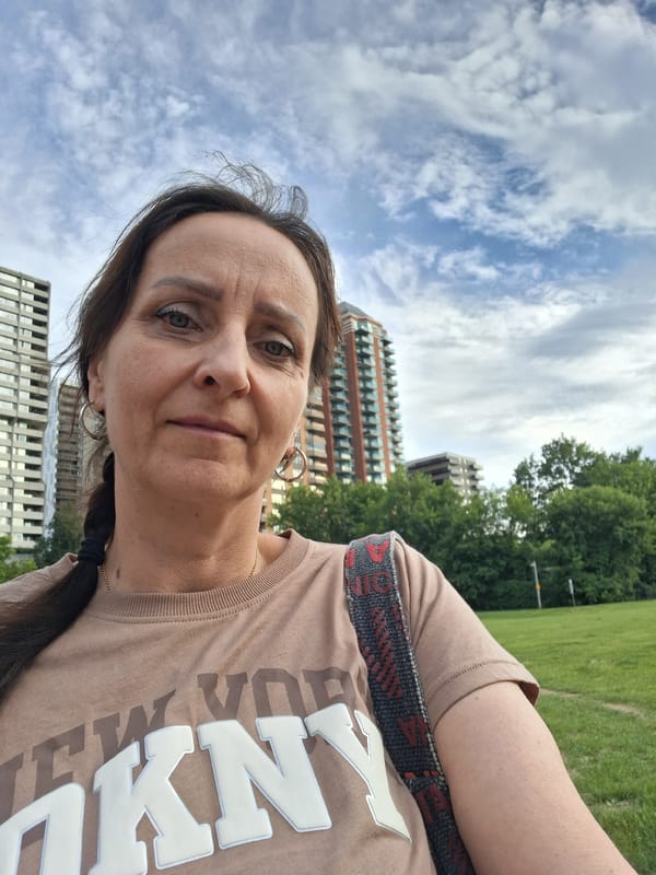Selfie stop near a fenced area in Ottawa
