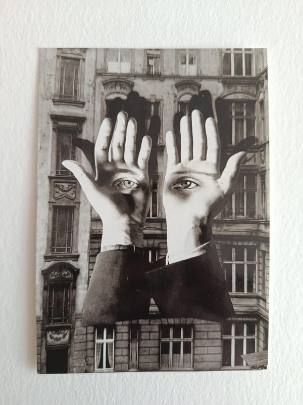 Surreal black-and-white print displayed on Moscow wall