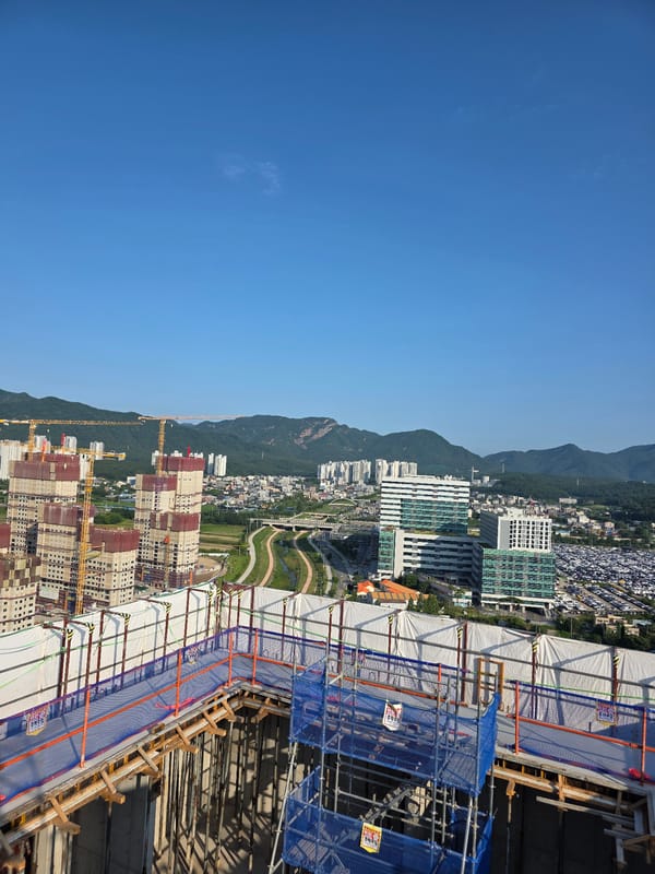 High-rise construction underway across a Daejeon building site