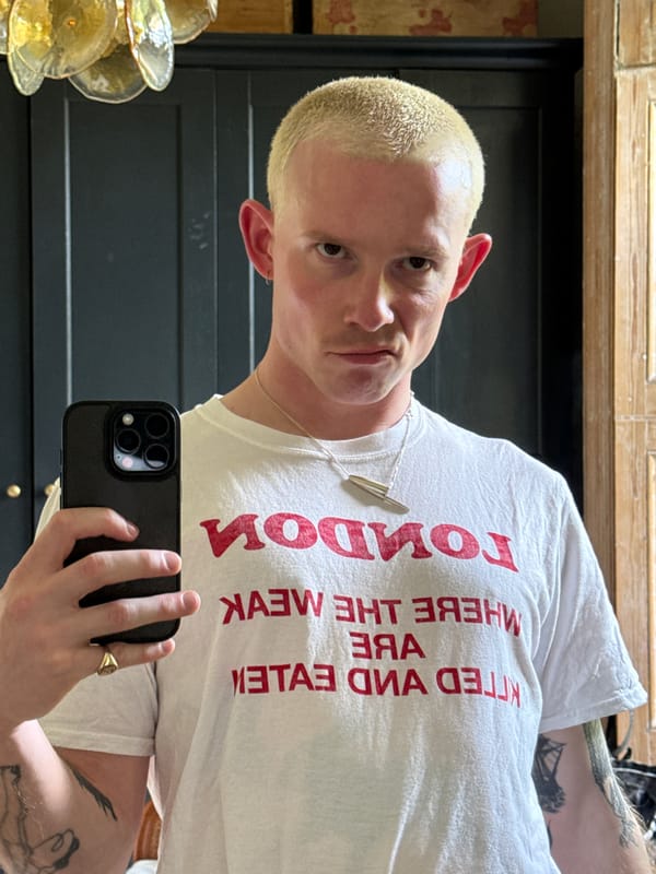 Person Takes Mirror Selfie in London Wearing Provocative T-Shirt