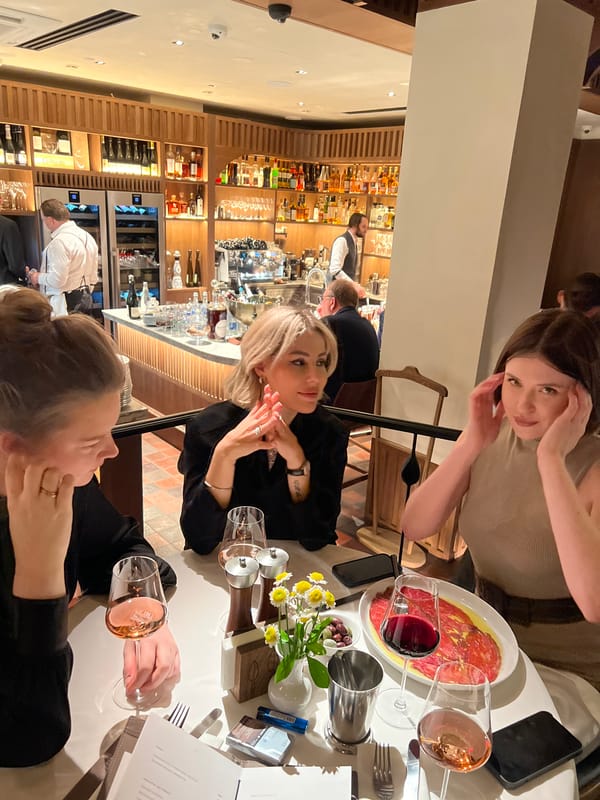 Women dine at upscale restaurant during evening hours
