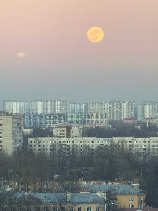 Full moon rises over Vsevolozhsk apartment towers