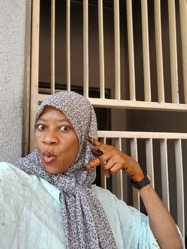 Woman photographed in various orientations outside Shaba building