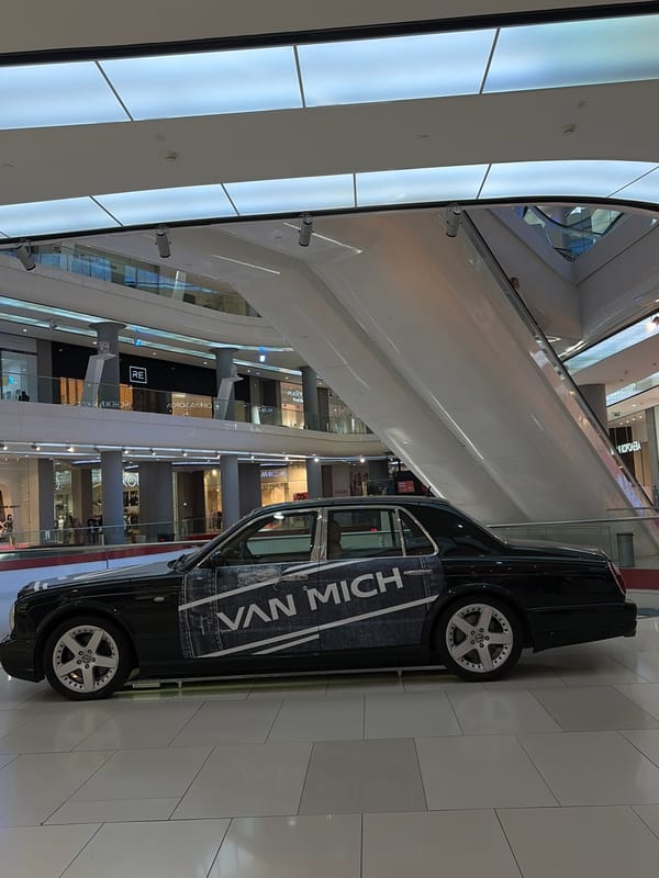 Shopping mall activity documented in Krasnodar featuring luxury car display