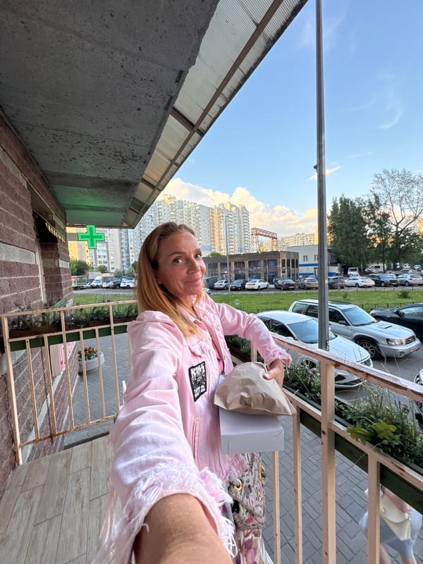 Bakery run near modern apartment blocks on a clear day