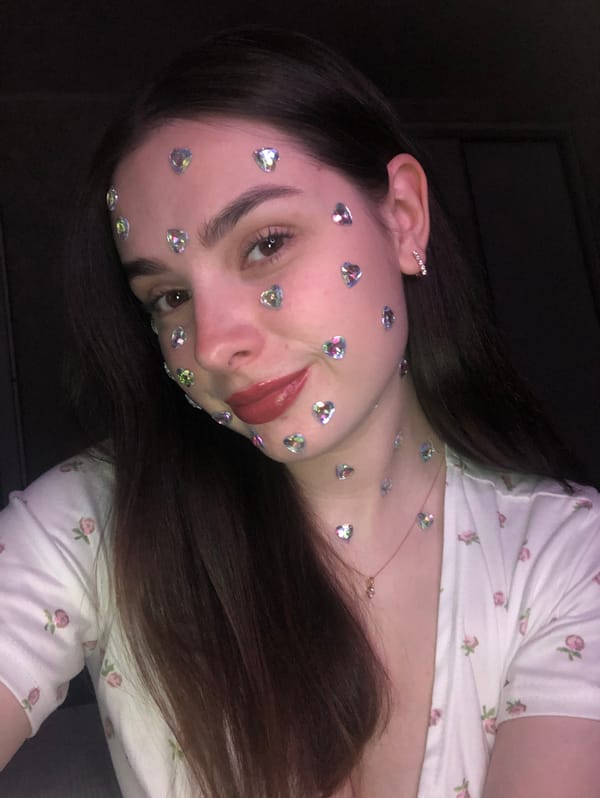 Woman photographed with decorative heart stickers in Noviy, Russia