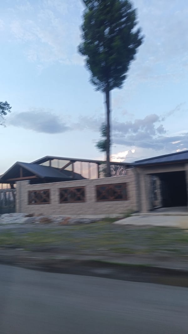 Vehicle passenger photographs buildings, highway near Aytos, Bulgaria
