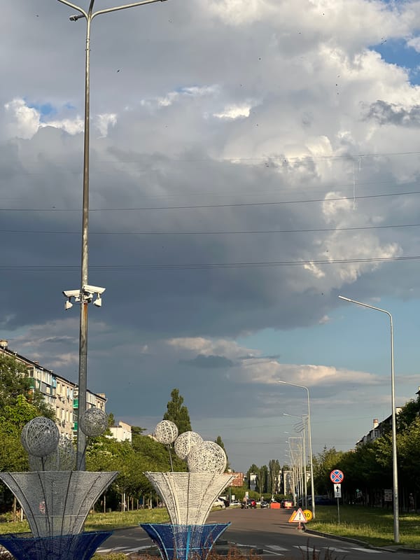 Storm clouds gathering over streets in Horishni Plavni