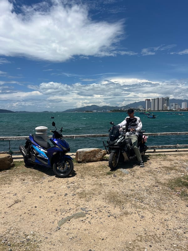 Early morning motorcycle scene at Vietnam coastal promenade