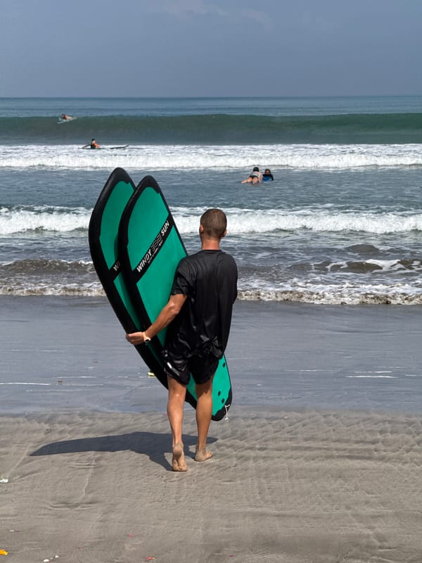 Early morning surf gathering at Kuta Beach, Indonesia
