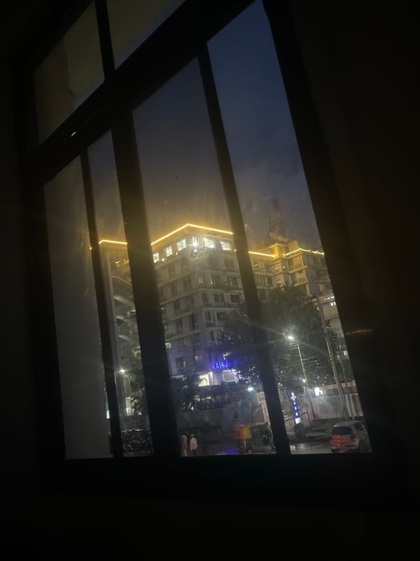 Nighttime cityscape view captured through window in Dar es-Salaam