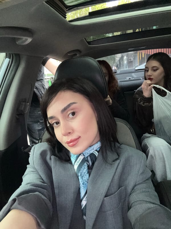 Women travel through central Tbilisi during afternoon hours