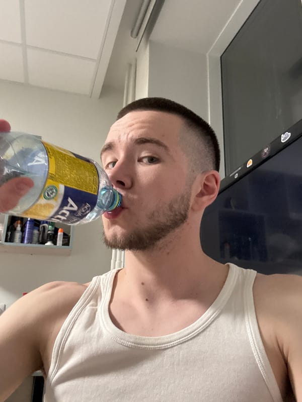 Man drinks water from bottle in Kazan, Russia