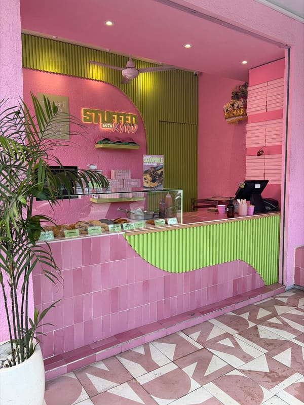 Inside and outside a pink dessert café in North Kuta