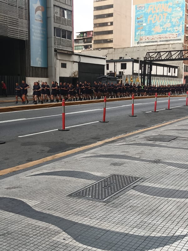 Group runs in formation on sectioned city street
