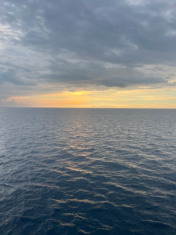 Calm sea meets gradient sky at South China Sea sunset