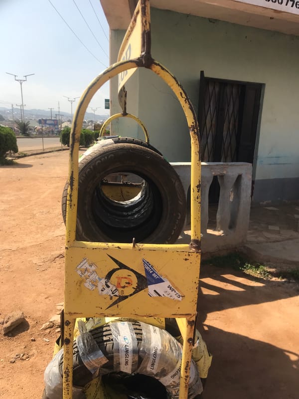 Street scenes captured in Jos Nigeria auto-rickshaws tire stand