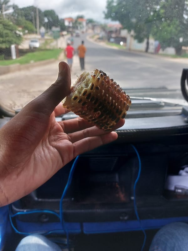 Street corn vendors serve customers in Dar es-Salaam