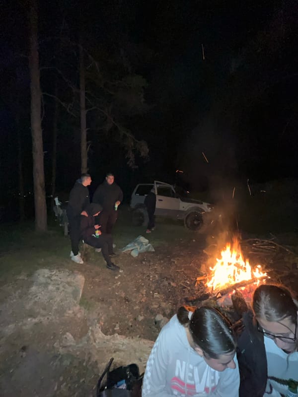 Evening bonfire gathering with drinks in Karavelovo, Bulgaria