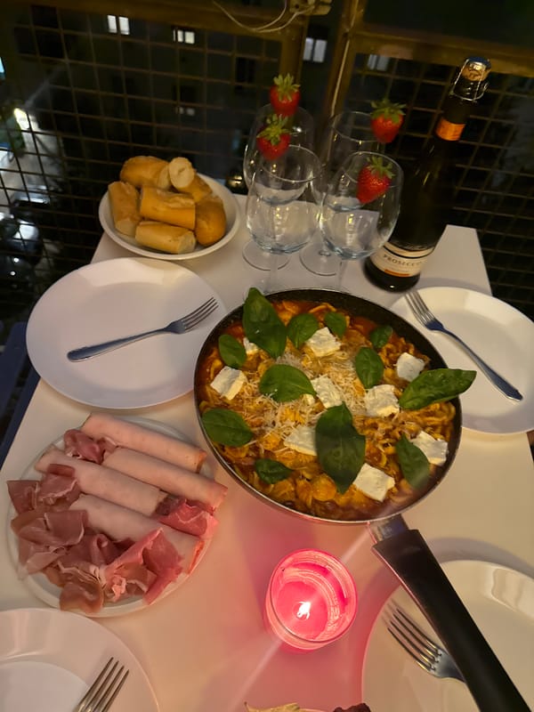 Candlelit pasta dinner captured in Milan evening setting