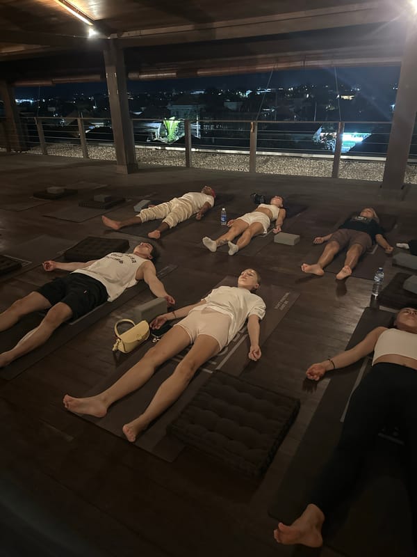 Yoga session observed in Mengwi indoor space overlooking cityscape