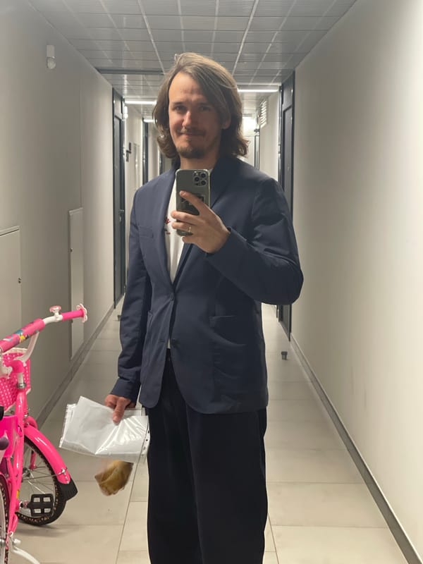 Man takes selfie in tiled hallway in Izhevsk