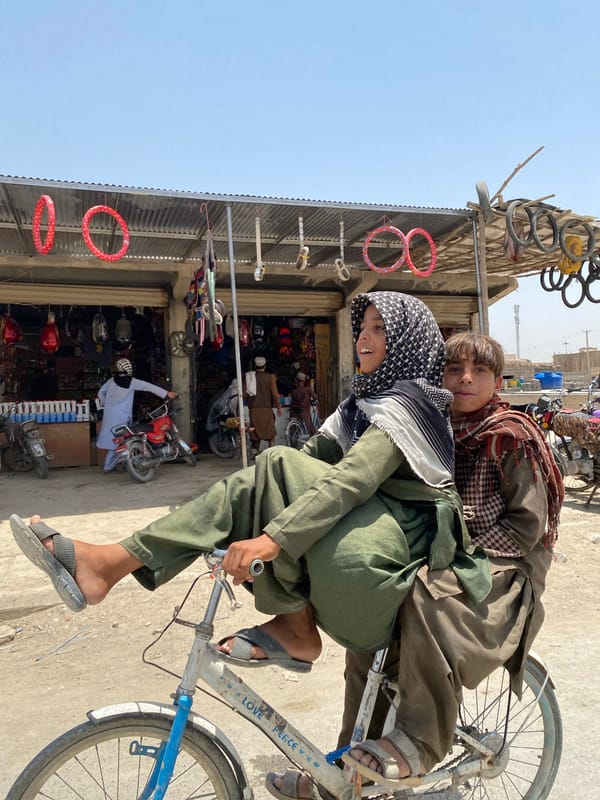 Sharing a bicycle through the streets of Kandahar