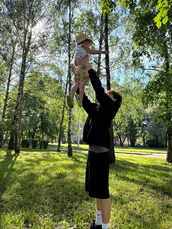 Family enjoys afternoon park outing with toddler and selfies
