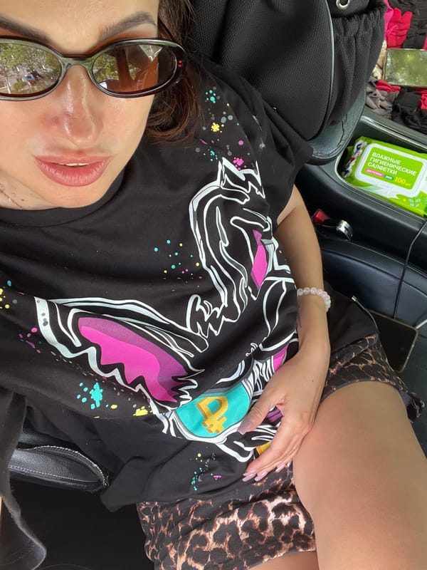 Quick car selfie session, black graphic tee and sunglasses