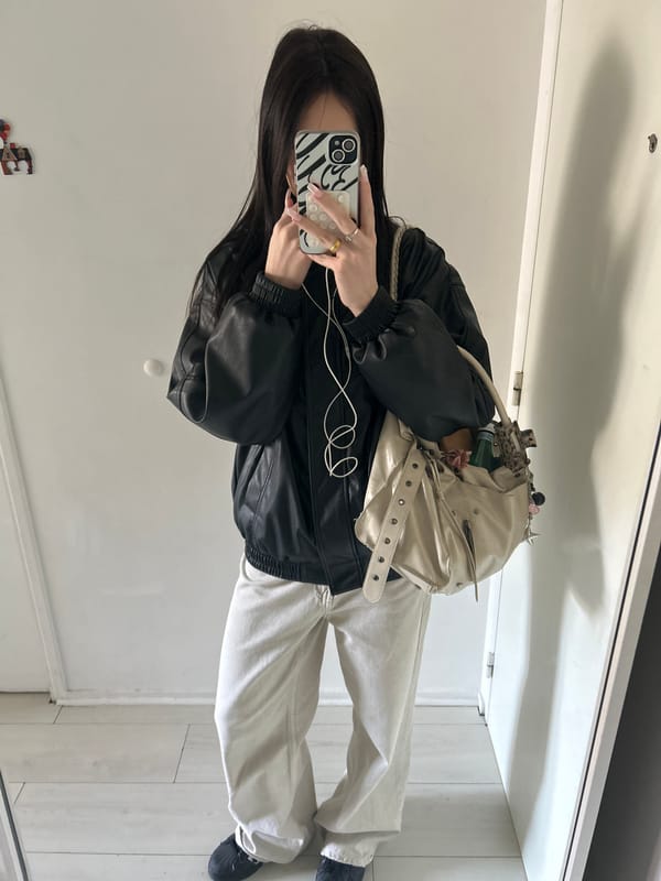 Young woman takes multiple mirror selfies in Cachan, France