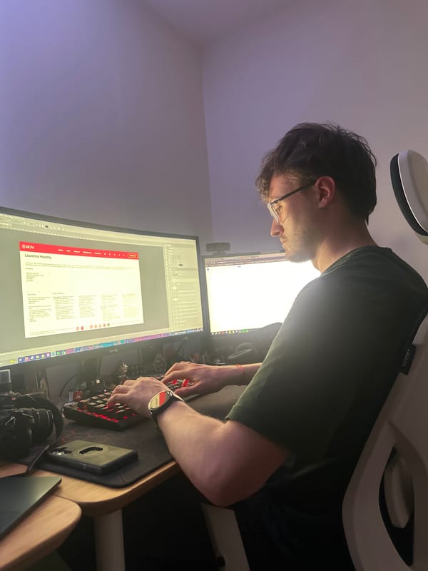 Man observed working at computer setup in Wealden