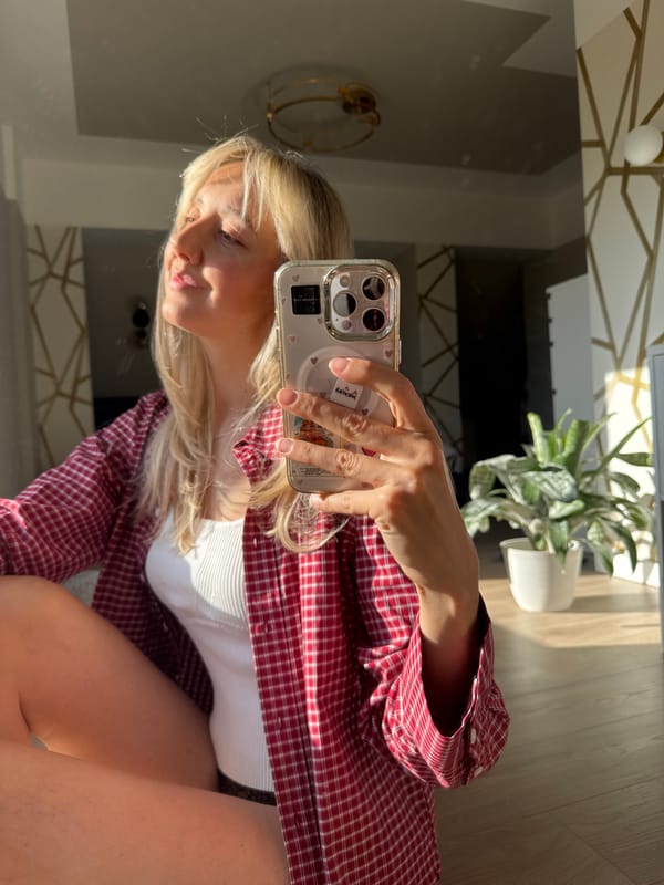 Woman takes morning selfies in Carnikava, Latvia apartment
