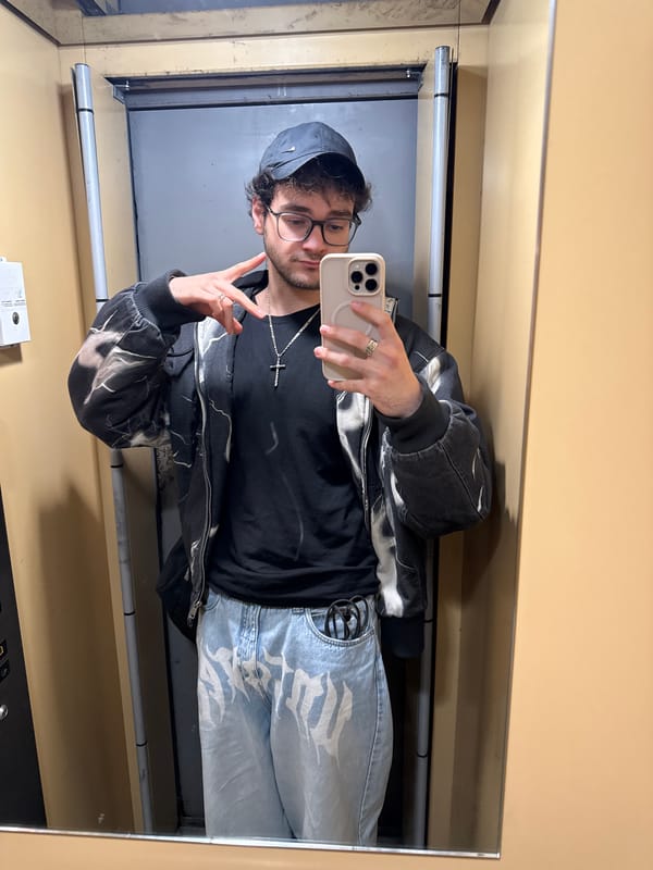 Young man takes mirror selfies in Blagoevgrad interiors