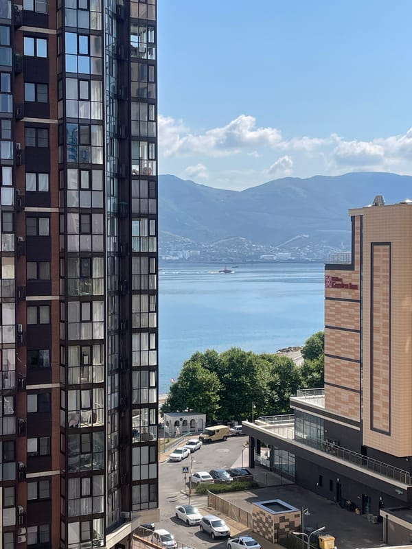 Sunny city morning: waterfront views and outdoor court activity
