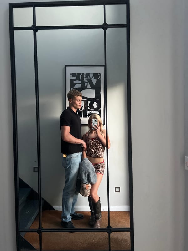 Couple photographed in mirror reflection in London