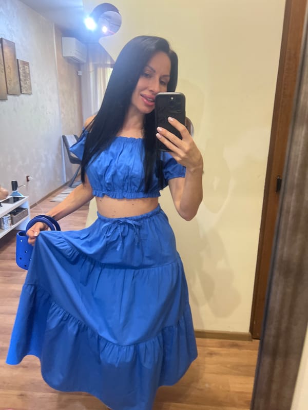 Woman takes mirror selfies in coordinated blue outfit in Bulgaria