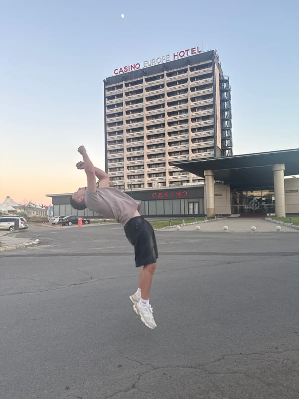 Acrobat performs backflips near Casino Europe Hotel in Nesebar