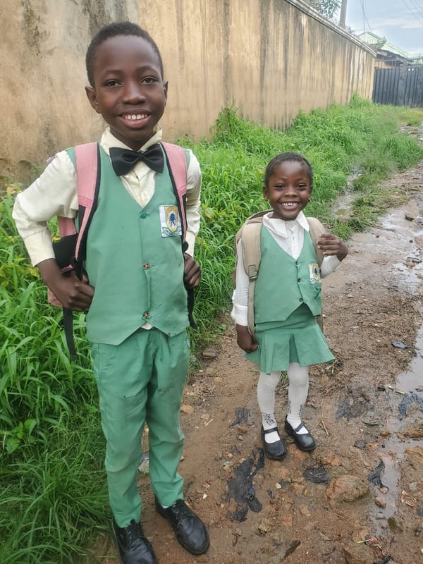 School uniforms and a cautionary graphic in Jos, Nigeria