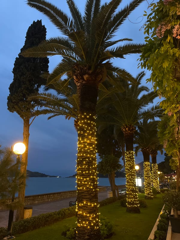 Evening twilight observed along coastal promenade in Rafailovići, Montenegro