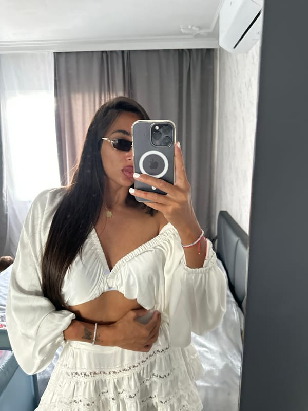 Woman conducts mirror selfie session in bedroom, Pernik Bulgaria