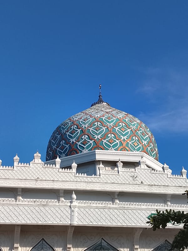 Mosque, cell towers, and café life in Lhokseumawe, Aceh
