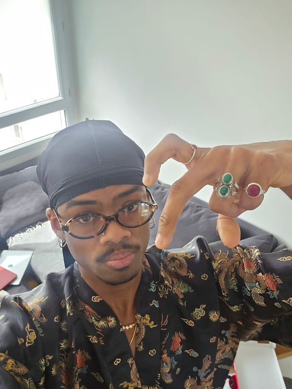 Man poses for photo in Pantin apartment