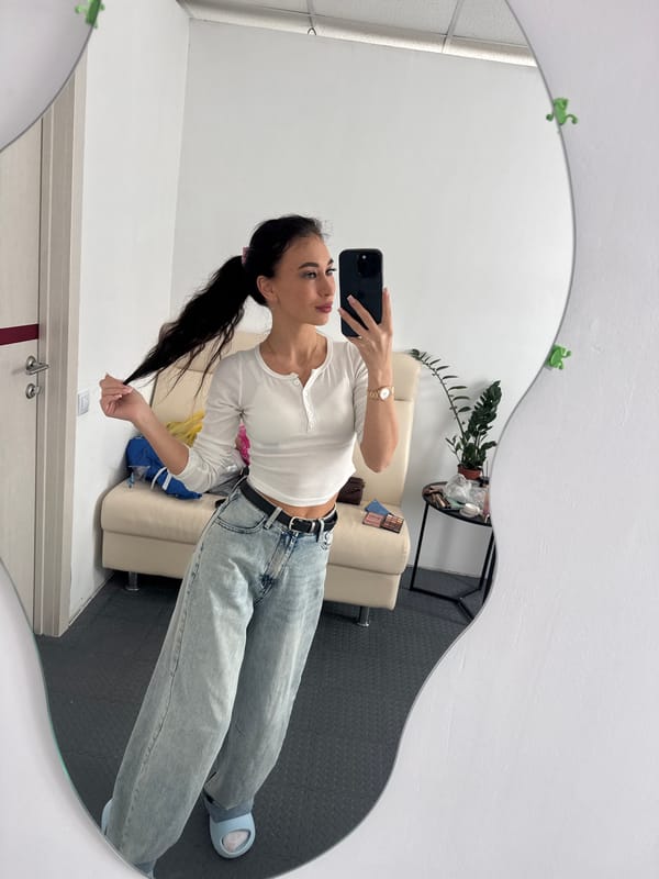 Woman takes mirror selfies with decorative frames in Russia