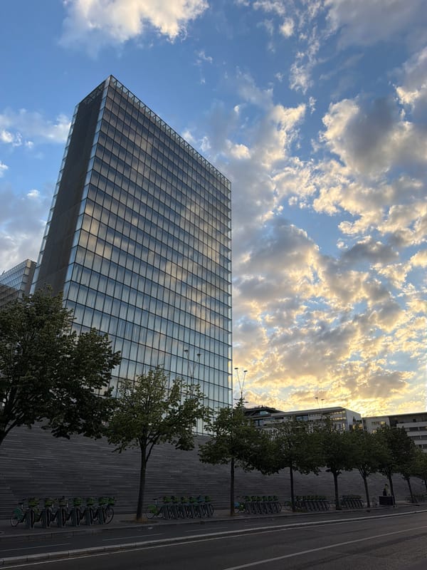 BnF towers and Seine-side terraces on a Paris evening