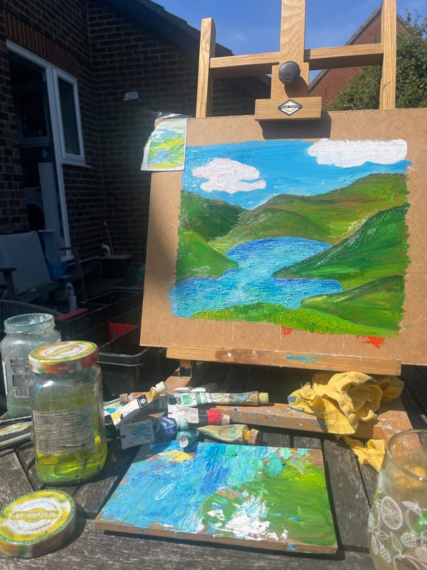 Artist paints waterfall landscape outdoors in Maidstone backyard