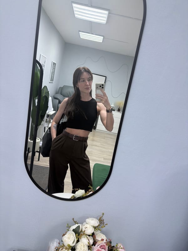 Woman takes mirror selfie in Perm, Russia room