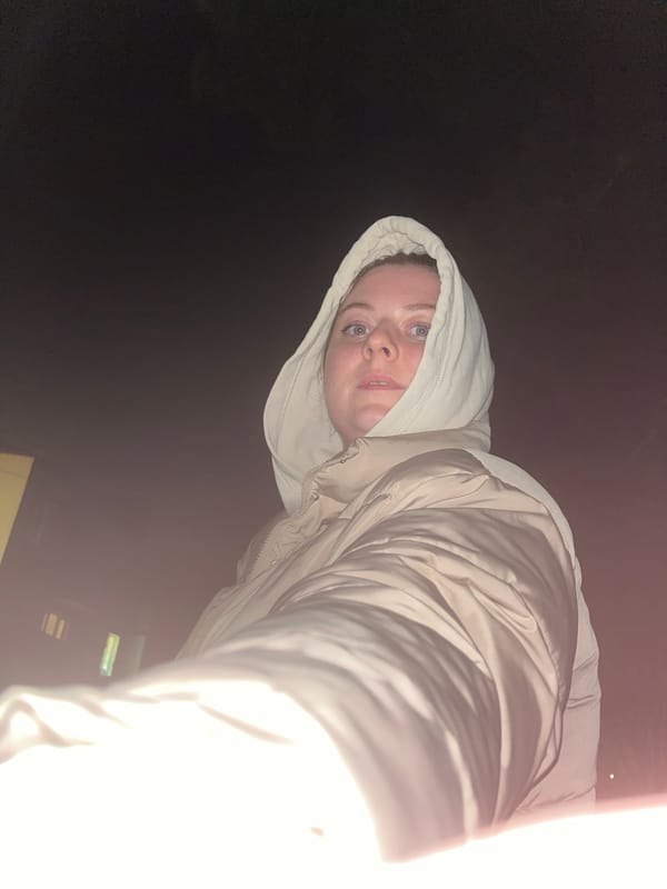 Person in hooded jacket photographed indoors in Раздолье
